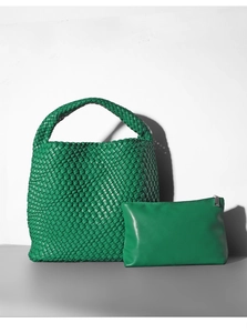 Detail of green woven bucket bag and matching zipper pouch in vibrant Kelly Green