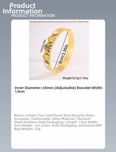 Detail of 60mm gold titanium steel bangle with heart and clover shell inserts