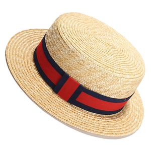 Classic straw boater hat with navy and red striped ribbon band on white background