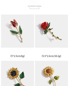 Detail view of sunflower and rose flower pins with rhinestones and alloy finish