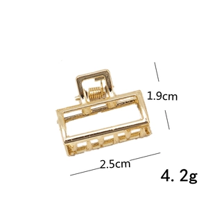 Mini gold metal shark hair claw clip with 2.5cm length and 1.9cm height dimensions