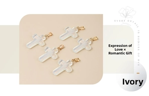 Detailed view of white opal glass cross pendants with golden metal clasps for DIY jewelry