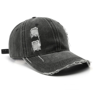 Retro washed black distressed baseball cap with ripped hole details and vintage street style