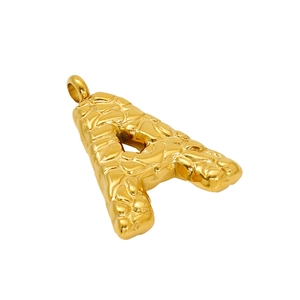 Textured gold capital letter A pendant necklace with hammered finish on white background