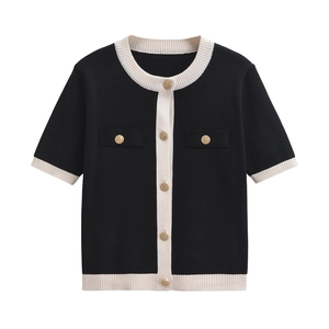 Elegant black and white contrast knit cardigan with gold buttons and short sleeves