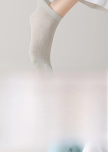 Detail of thin mesh silk socks featuring seamless toe design and vertical ribbed texture