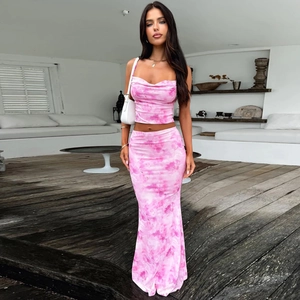 Detail view of pink tie-dye two-piece set featuring cropped top and fishtail skirt