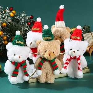 Close-up of cute Christmas teddy bear plushies with LOVE hats and festive scarves
