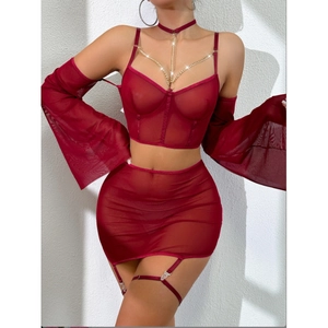 Three-piece burgundy mesh lingerie set with gold chain halter top and garter skirt