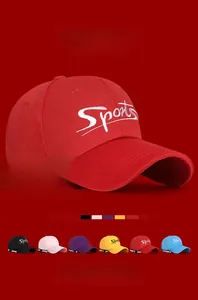 Detail view of red baseball cap with embroidery and multi-color options below