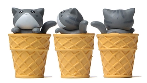 Three-angle views of a grey tabby cat figurine sitting in a yellow waffle ice cream cone