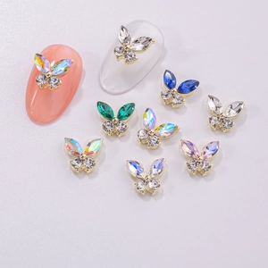 Colorful 3D alloy butterfly nail art charms with crystal rhinestones on light background