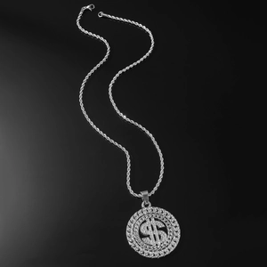 Macro shot of silver hip-hop spinning dollar sign pendant with iced-out diamonds and twist chain