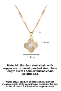 Detail of clover pearl pendant with micro-inlaid crystals on gold titanium steel chain