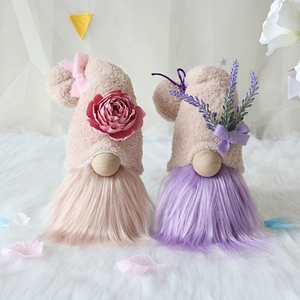Pink and purple Valentine's Day gnomes with flower hats and long plush beards