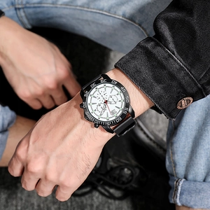 Men's sports watch with white dial, black bezel, and rubber strap on male wrist