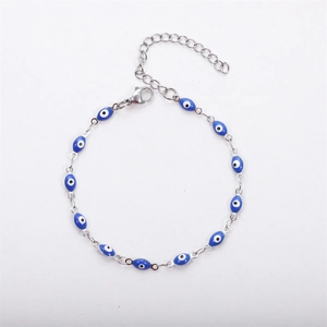 Silver stainless steel bracelet with blue evil eye beads and lobster clasp on white background