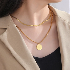 Double-layered gold titanium steel necklace featuring a coin pendant and flat snake chain