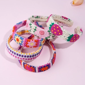 Selection of handmade crochet headbands with strawberry and floral knit patterns