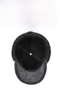 Detailed interior of winter thermal cap showing thick black lining and reinforced stitching