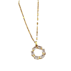 Minimalist gold titanium necklace featuring a round circle pendant set with zircon stones