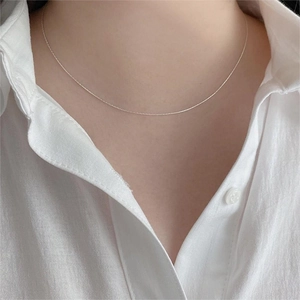 Minimalist 925 sterling silver thin bamboo chain necklace worn on model neck
