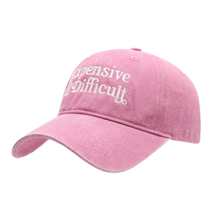 Pink washed cotton baseball cap with white letter embroidery and adjustable soft top