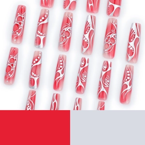 Long coffin nails featuring red gradient and silver metallic tribal stripe patterns