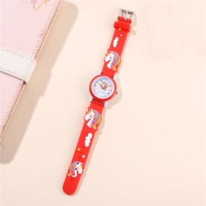 Macro detail of children's unicorn watch with red 3D embossed silicone strap and rainbow dial