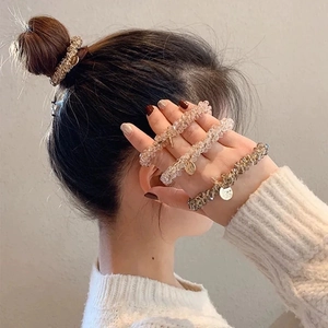 Elegant crystal bead hair tie set with metallic pendant for versatile styling