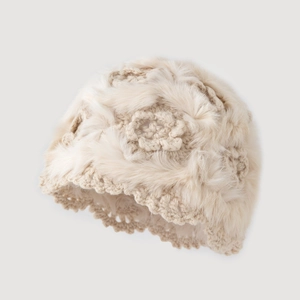 Elegant beige knit plush bucket hat with crochet flower pattern for winter warmth