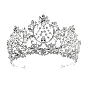 Macro shot of silver bridal crown featuring floral patterns and shimmering teardrop rhinestones
