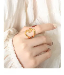 Detailed view of the gold-plated twisted rope texture on an irregular wrap ring
