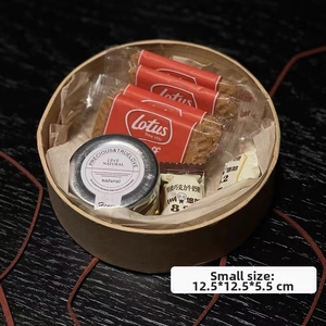 Detail view of round kraft paper gift box with cookies and jam inside, 12.5x12.5x5.5cm