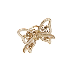 Elegant gold hollow butterfly hair claw clip with white pearls on a clean white background