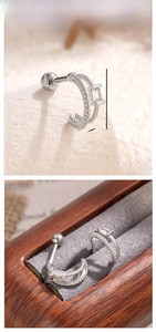 Detail view of silver double-layered ear stud with zircon inlay and 12mm x 4.5mm dimensions