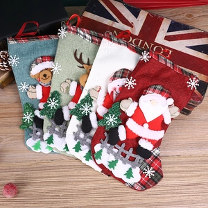 Set of 4 rustic Christmas stockings with 3D Santa and reindeer on wooden background