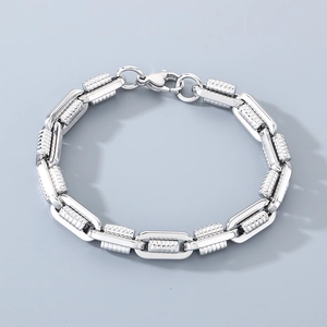 Detailed macro view of the silver industrial chain bracelet showing polished steel texture