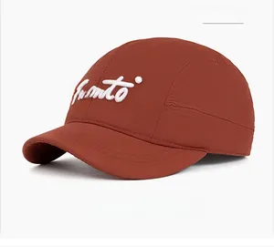 Close-up of quick-dry nylon baseball cap in brick red with white script embroidery