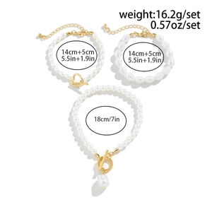 Three-piece set of baroque pearl bracelets with gold-tone heart OT buckles and charms