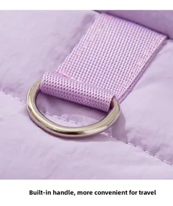 Close-up of durable metal D-ring attachment on purple quilted pet winter jacket