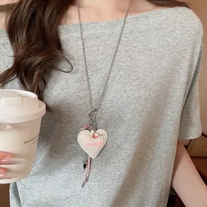 Sweet cream leather heart pendant necklace with silver bead chain on model