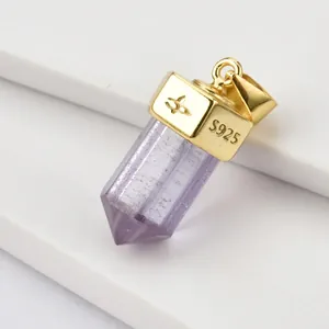 Detail view of S925 sterling silver stamp on golden hexagonal crystal stone pendant