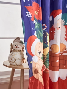 Detail of Santa Claus print on blue blackout Christmas curtain with smooth fabric texture