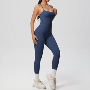 Detail of dark blue yoga set with high waist leggings and thin strap sports bra