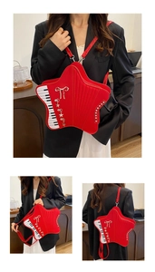 Detailed view of red star-shaped bag featuring piano key side panels and star charms
