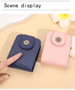 Detailed view of small faux leather coin purses with metallic daisy snap closures