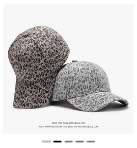 Detail view of leopard print baseball caps showing fabric texture and color options