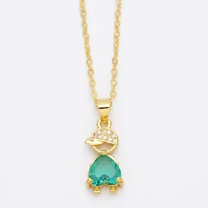Minimalist gold necklace featuring a cute boy pendant with emerald heart gemstone and zircon cap