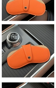 Litchi pattern orange leather car glasses holder with snap button on center console